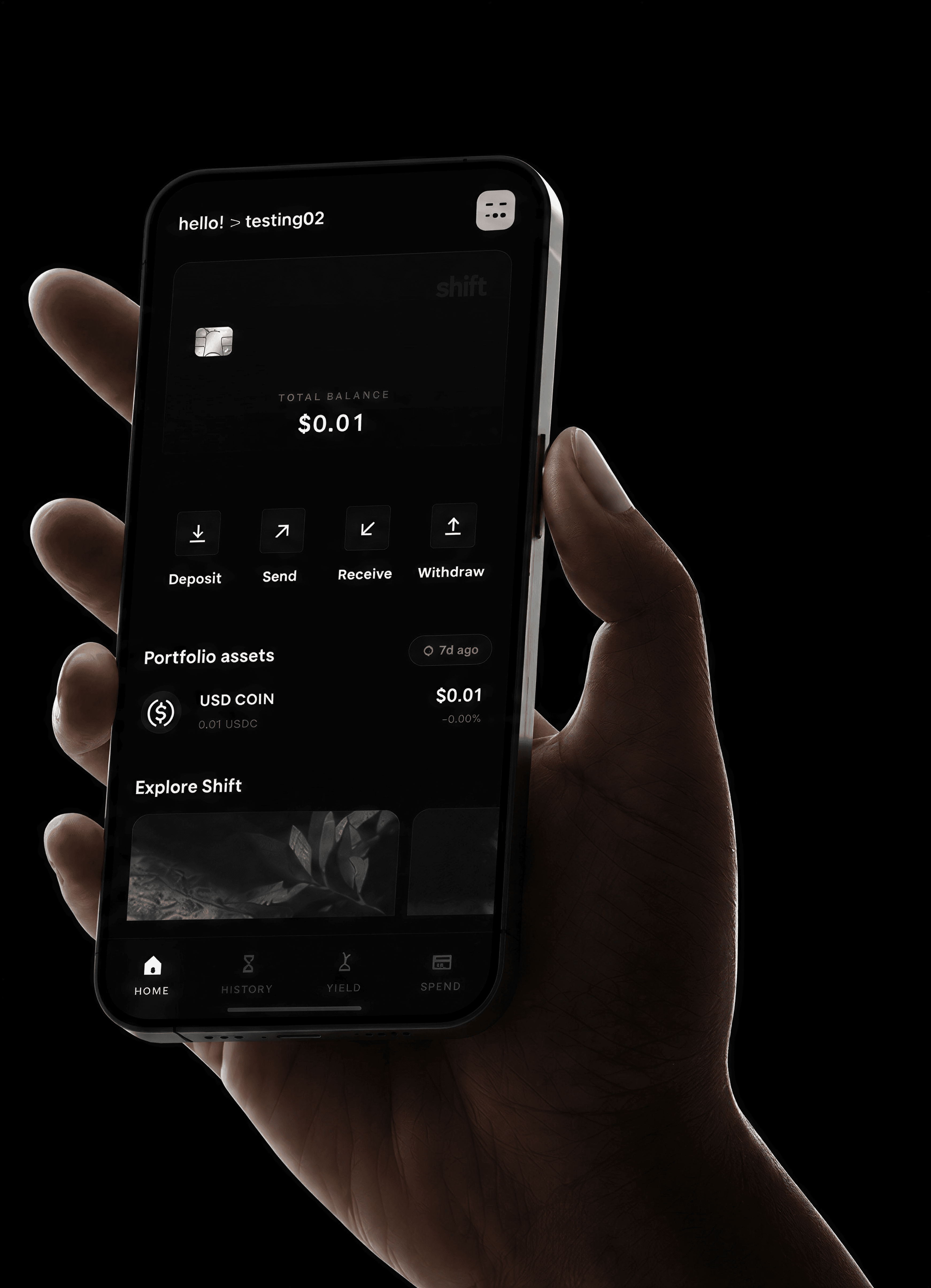 A hand holding a phone showing the Shift app, its balance and its deposit, send, receive and withdraw controls.